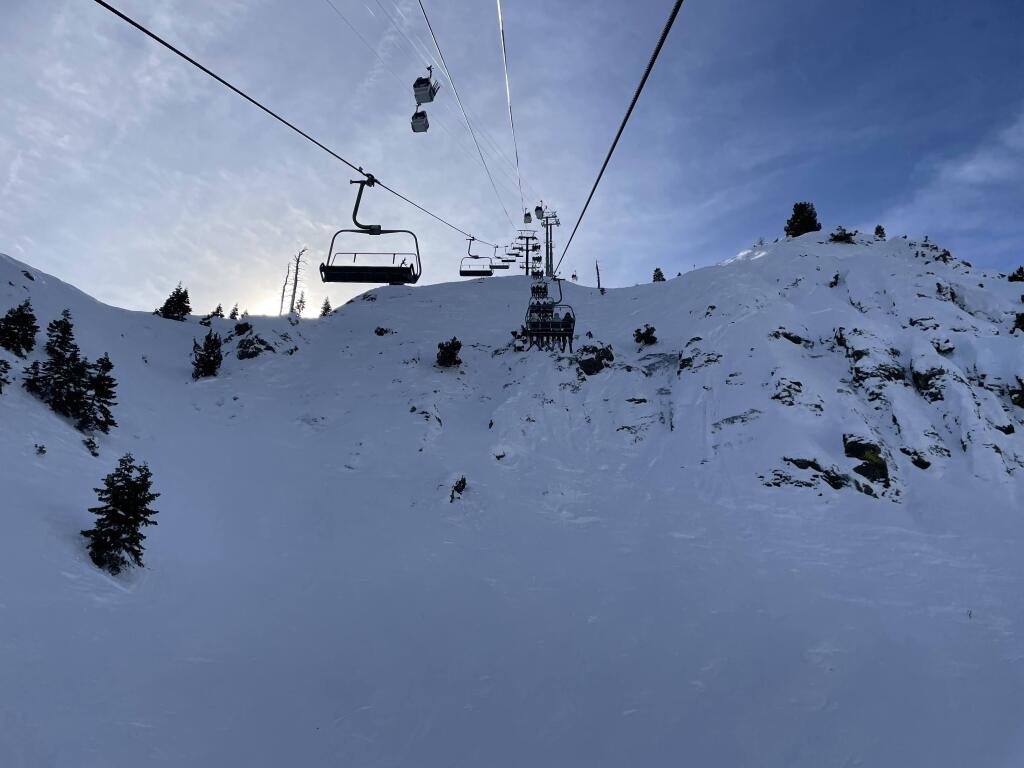 KT-22 steep lift line with the base to base gondola above at Palisades Tahoe, January 2026